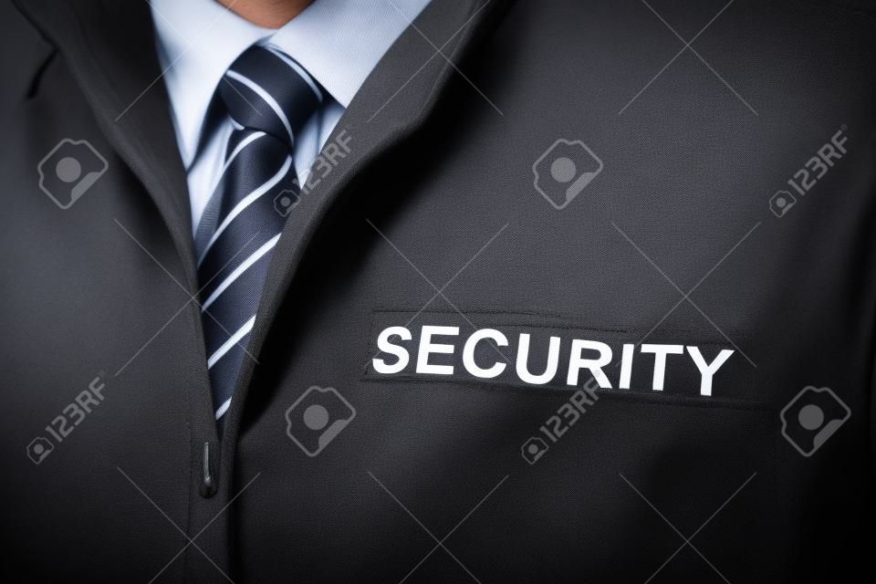 Close-up Di Vigilanza Uniforme da portare con il testo di sicurezza