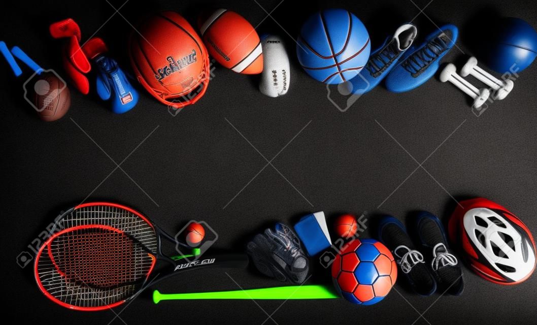 High Angle View Of Various Sport Equipment On Black Background