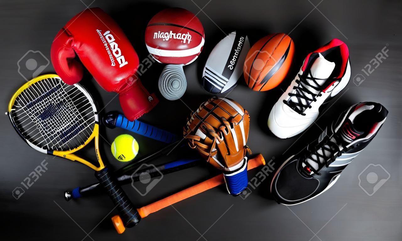 High Angle View Of Various Sport Equipment On Black Background