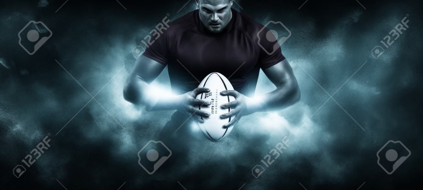 Gracz rugby w akcji na ciemnym tle areny