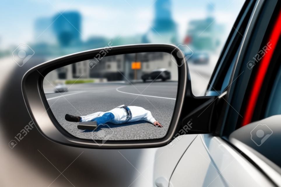 Rearview mirror with a man hit by a car - car accident concept