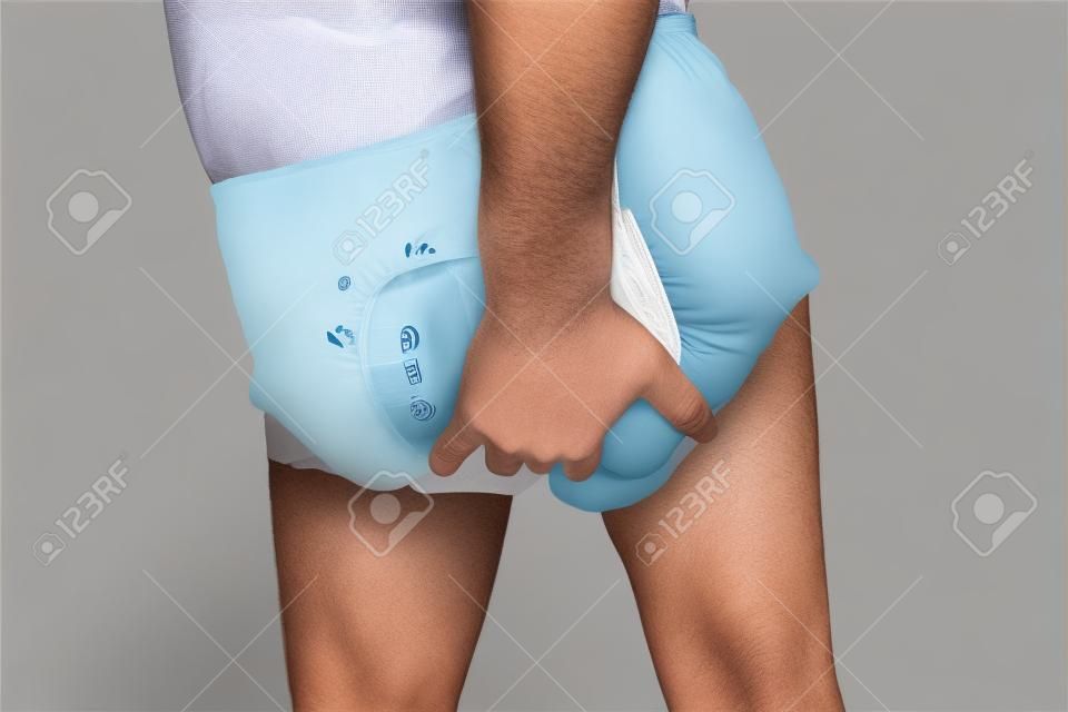 Man wearing incontinence diaper - urinary incontinence concept