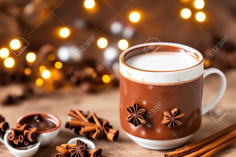 Cup of hot chocolate with cinnamon sticks