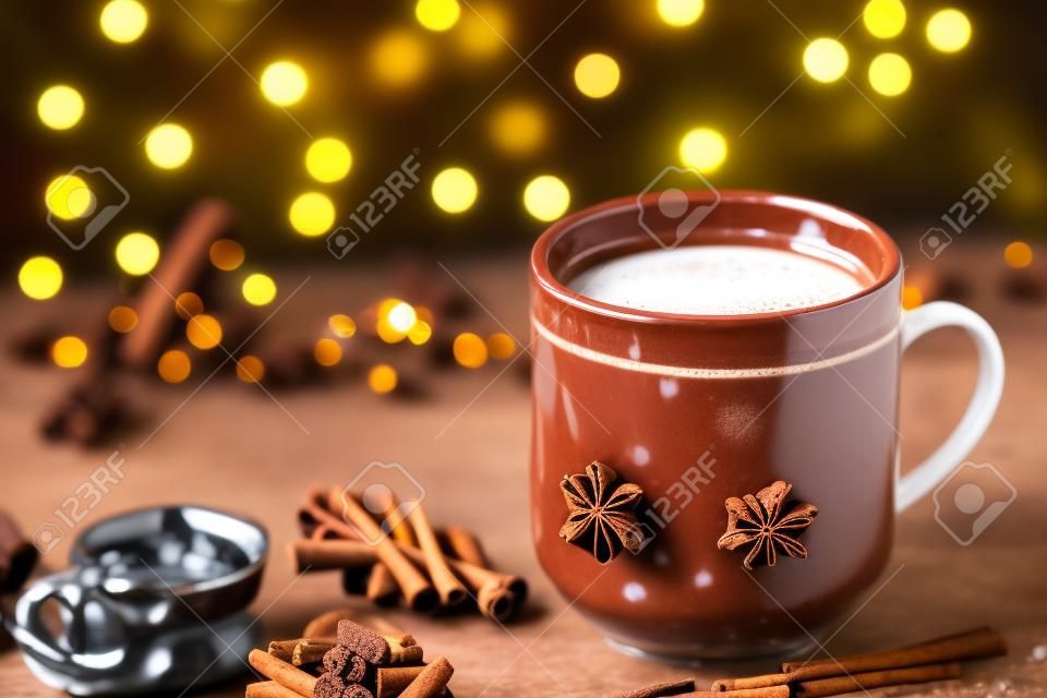 Cup of hot chocolate with cinnamon sticks