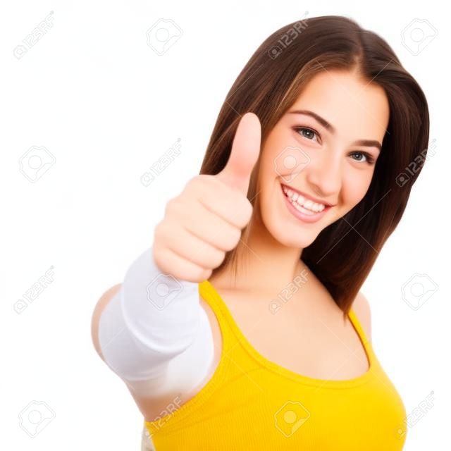 Retrato de un adolescente hermoso con el pulgar arriba gesto aislado sobre un fondo blanco