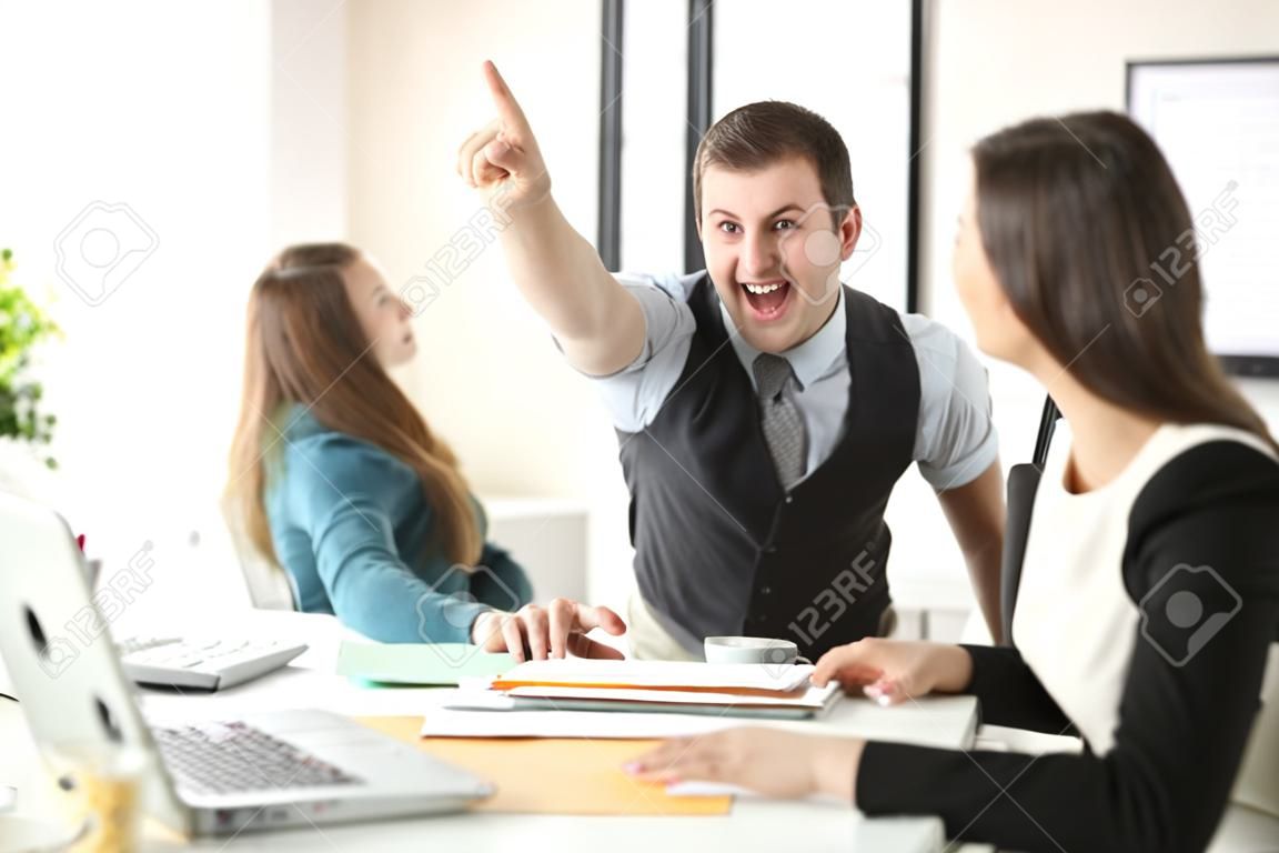 Two excited coworkers celebrating achievement giving five at office