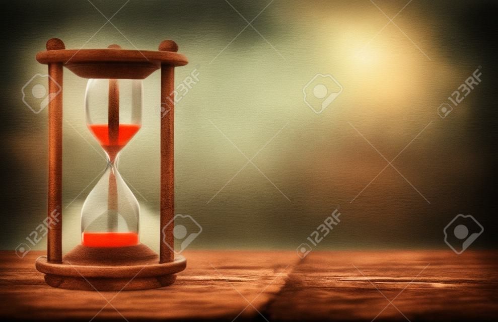 Hourglass with blur city at evening time. Beauty and past moments concepts with copy space. vintage style