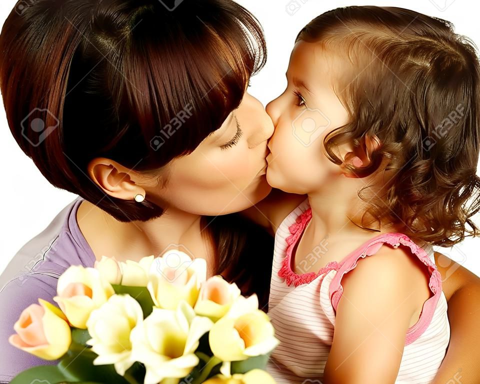Happy mother kissing her daughter on mother's day