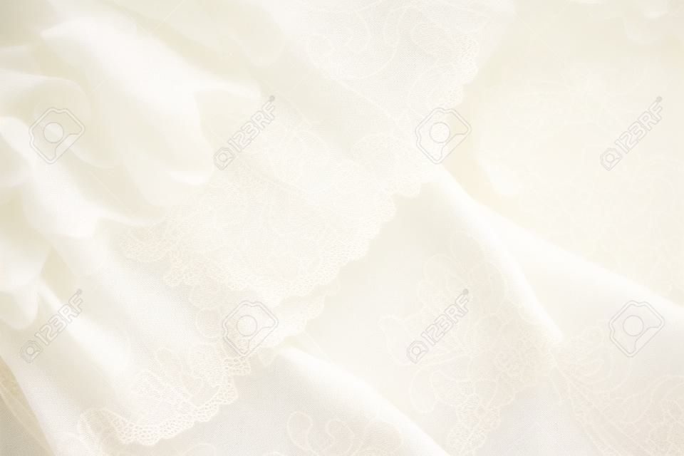 Primo piano di beige bianco avorio e tessuti di pizzo d'epoca