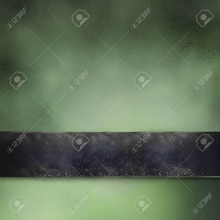 abstract black and green background with vintage grunge texture smeared on paper with black edges and bright highlight under black ribbon stripe