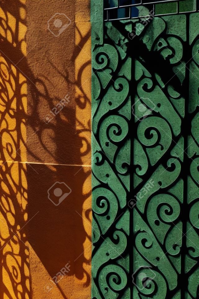 Shadow from a beautiful ornamented gate in an old city