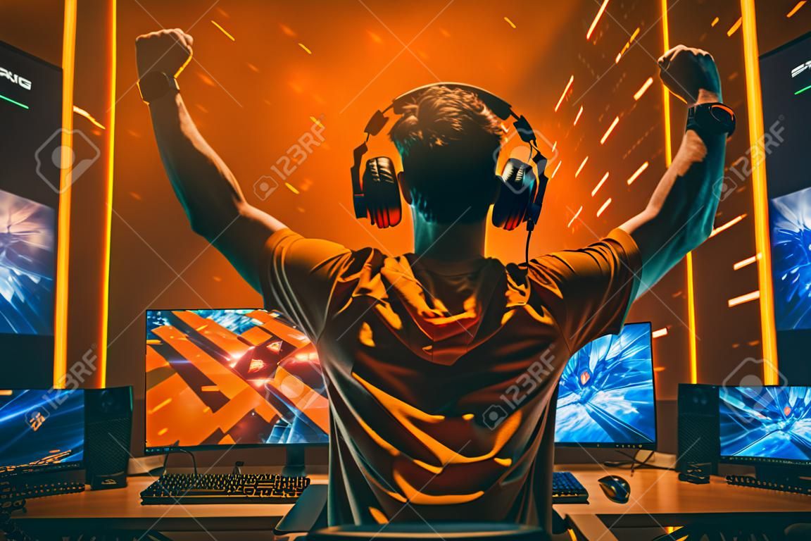 Gamer celebrating victory. Electronic sports player rejoices victory in e-sports tournament. Winning an eSports game