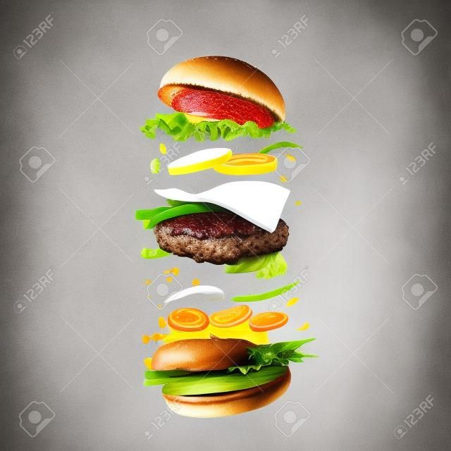 Ingredientes de hambúrguer contra fundo branco