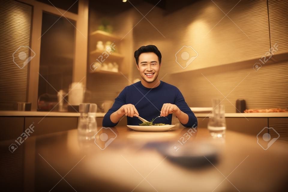 Photo of young handsome man good mood enjoy tasty meal seafood steak cuisine diet calories yummy indoors