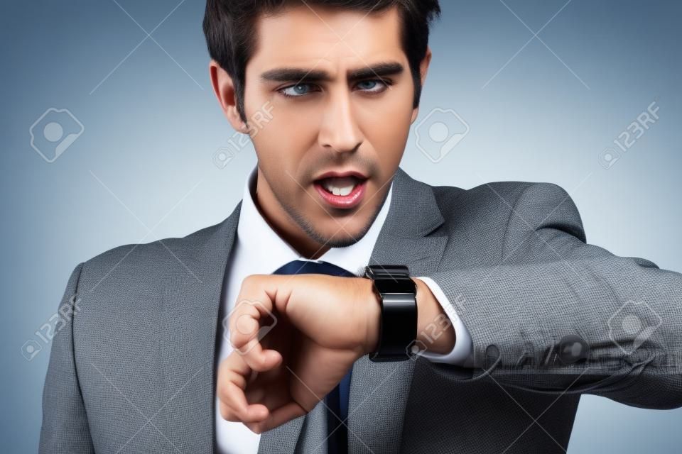 businessman in a hurry looking at his watch