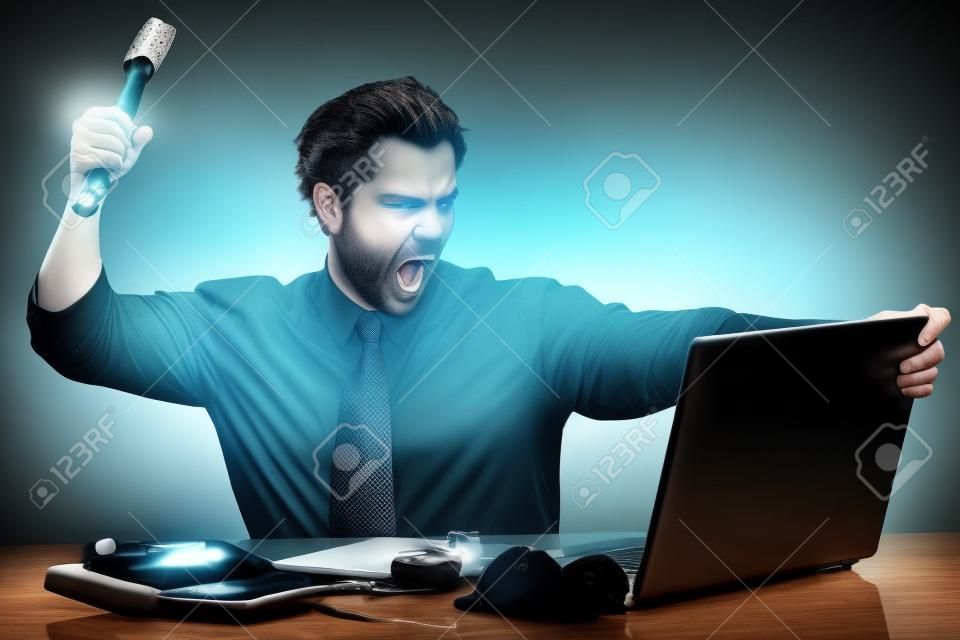 Executive about to smash his laptop with a hammer 