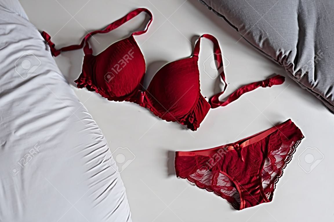 red bar and panty lingerie set on bed