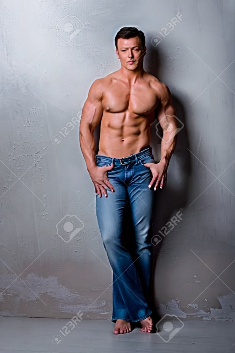 Handsome muscle man in jeans