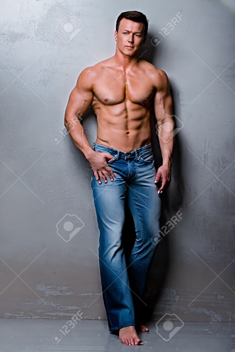 Handsome muscle man in jeans