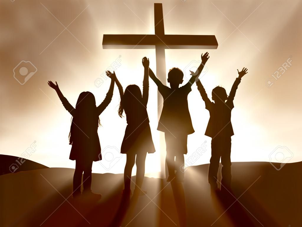 Silhouettes dzieci w Cross Jezusa Chrystusa.