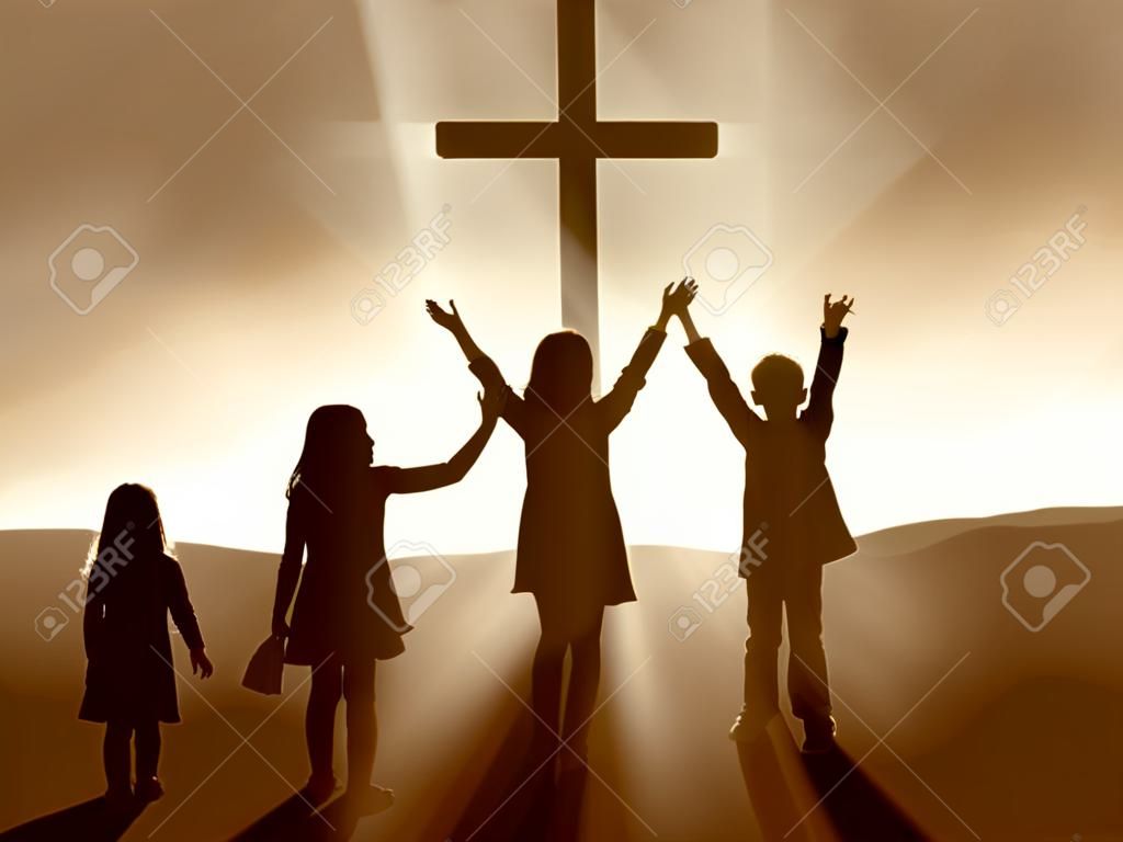 Silhouettes dzieci w Cross Jezusa Chrystusa.