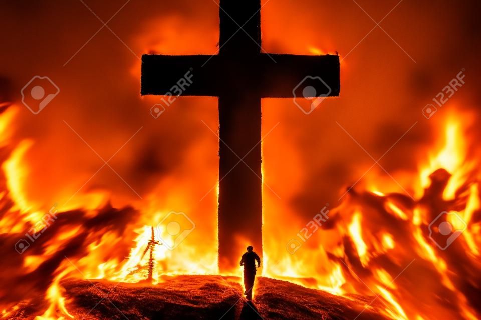 Person running from fire to safety of the Cross cut into a giant mountain