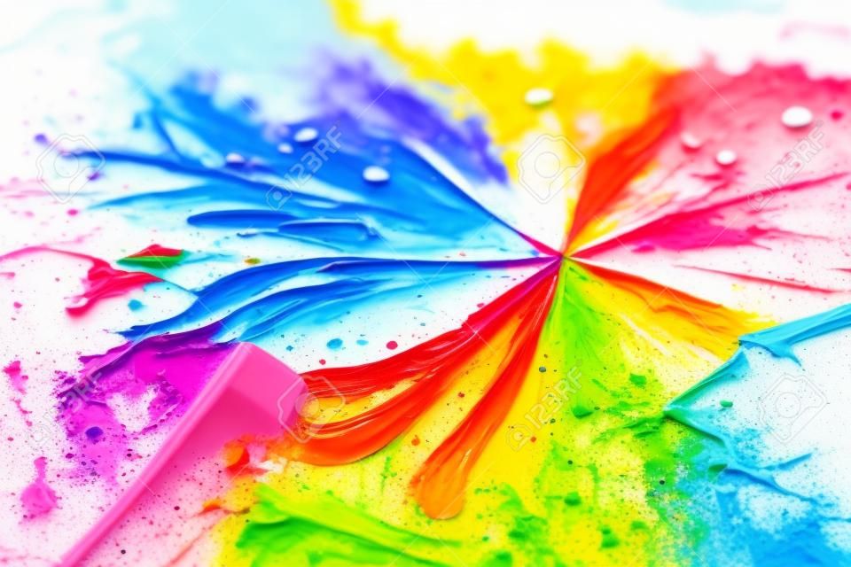 Colorful paint splashes on a white background. Close-up.