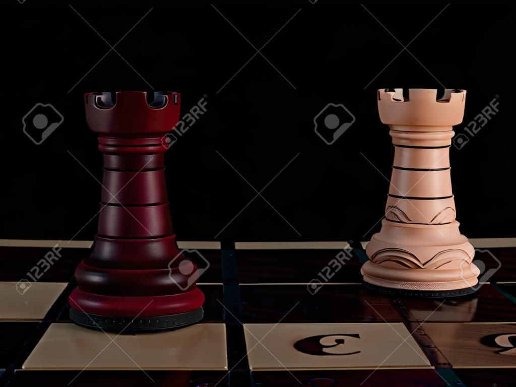Two hand-decorated, wooden, chess towers are standing on a chessboard.
