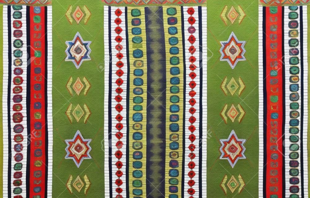  A traditional ornament of peoples and countries of Latin America in which rich colors attract attention and wealth. Women's woven carpets with ornament embroidered on fabrics for dresses. Embroideries