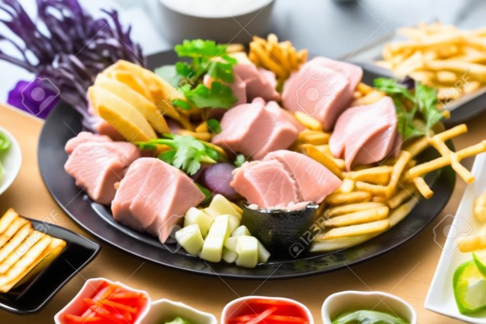 tuna sashimi platter and assorted fries