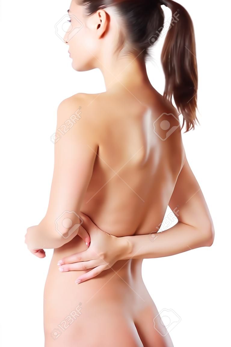 Young woman with pain in her back. Isolated 