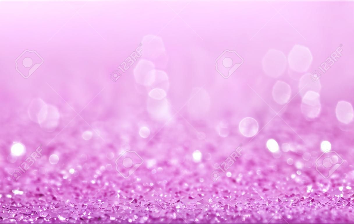 Pink defocused glitter background with copy space