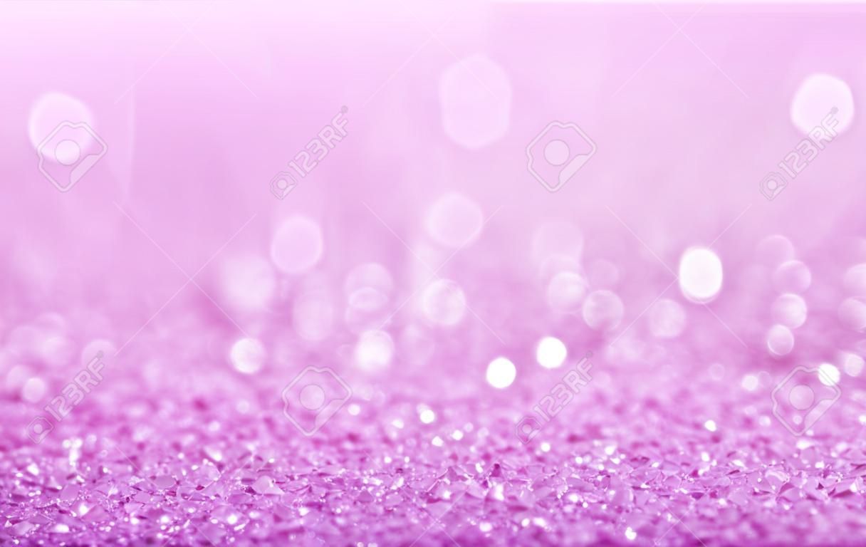 Pink defocused glitter background with copy space