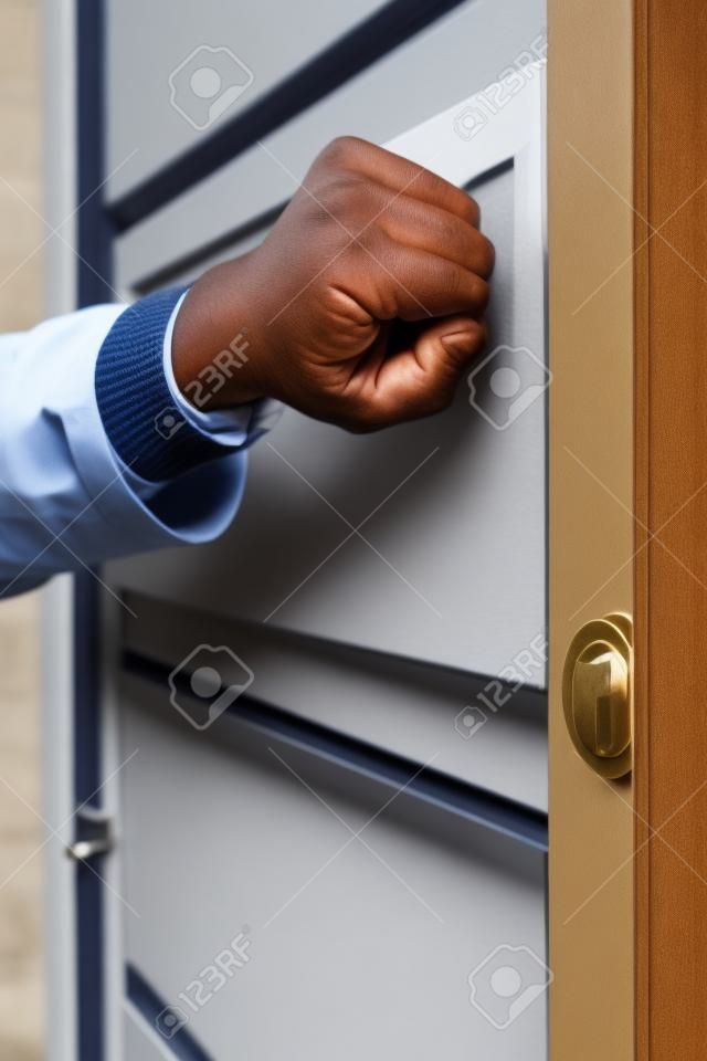 Door to door salesman knocking on the door
