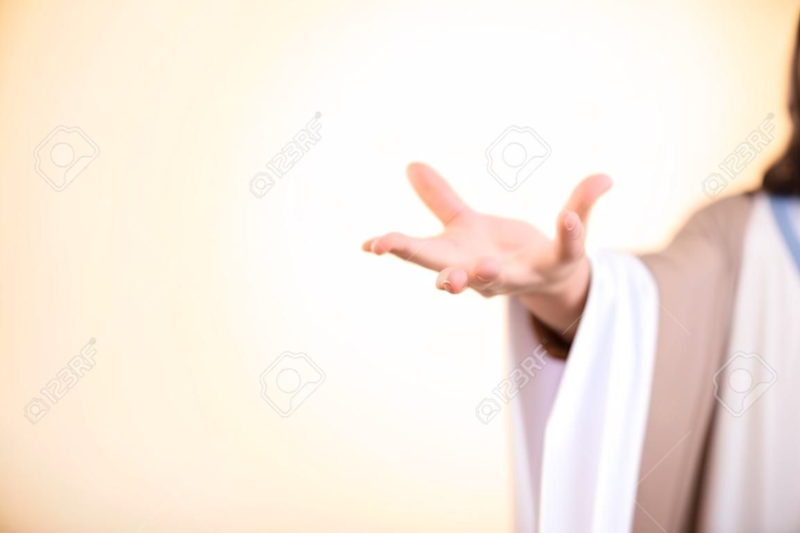 Messiah reaching out his hand isolated on illuminated background