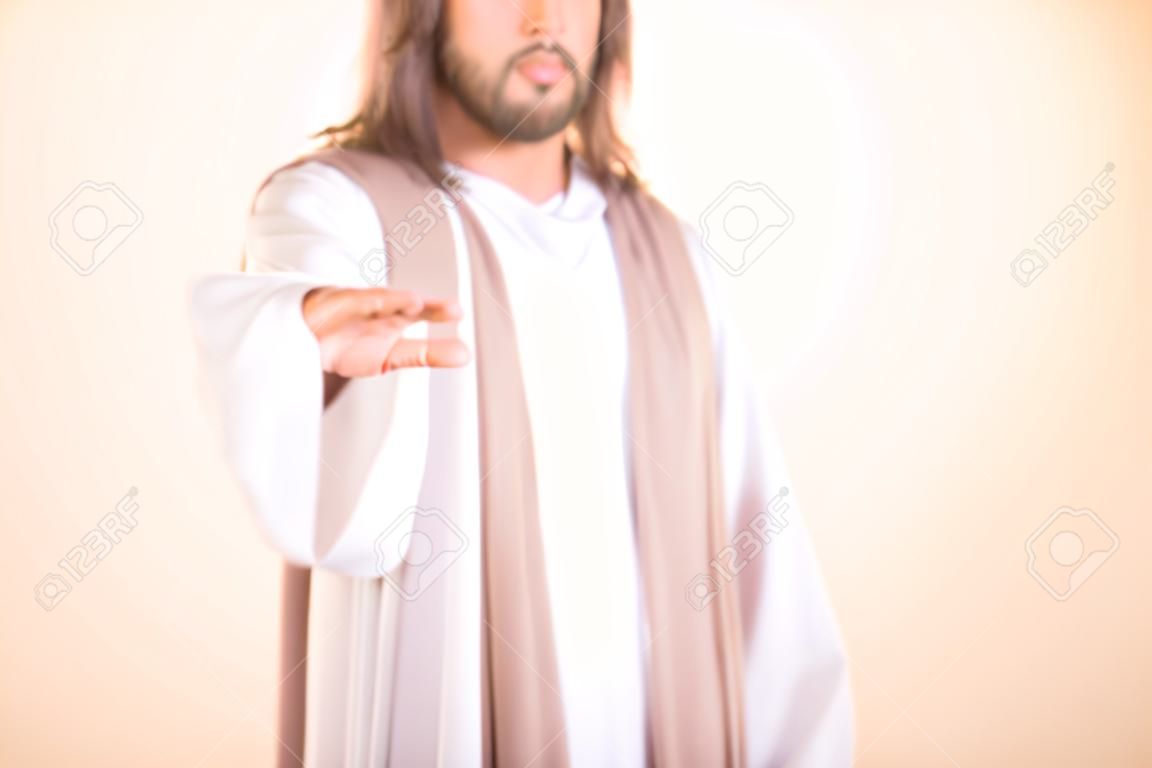 耶稣基督伸出他的手的照片