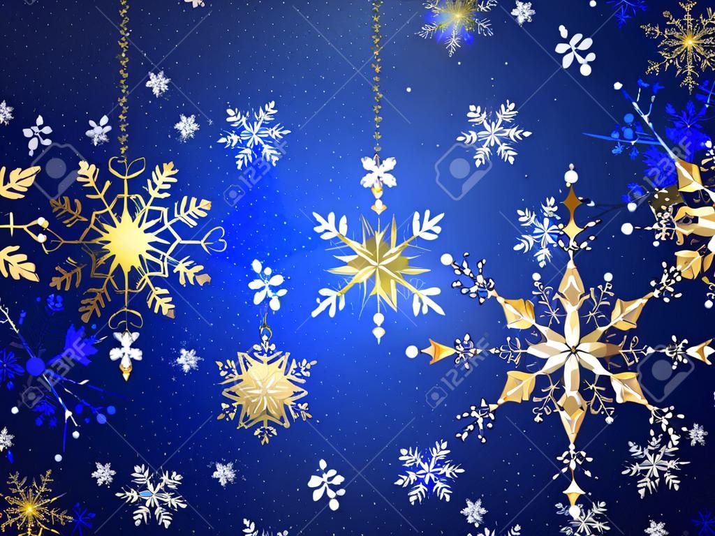Blauwe Kerst achtergrond met goud en witte sieraden sneeuwvlokken. Gouden sneeuwvlokken.