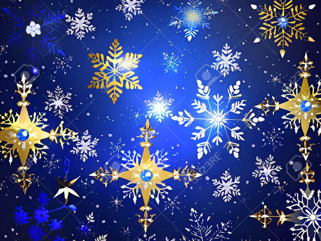 Blauwe Kerst achtergrond met goud en witte sieraden sneeuwvlokken. Gouden sneeuwvlokken.