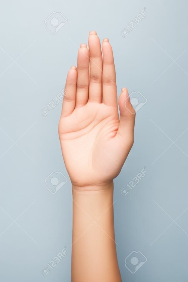 Palma Mujer gesto de la mano, aislados en un fondo blanco
