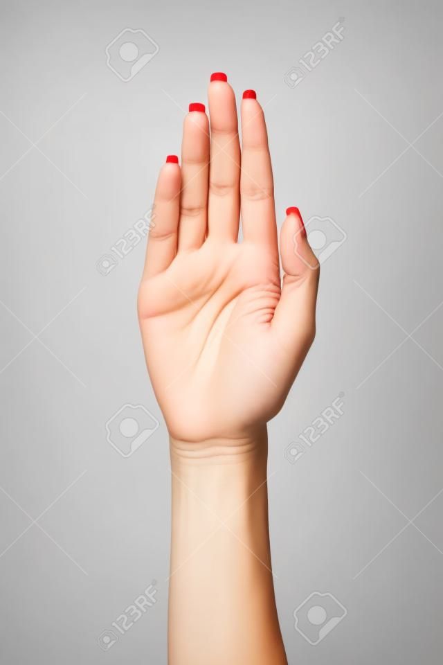 Palma Mujer gesto de la mano, aislados en un fondo blanco