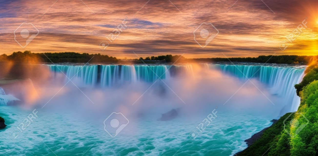 Panorama of Canadian side view of Niagara Falls, Horseshoe Falls and boat tours at sunset in Niagara Falls, Ontario, Canada
