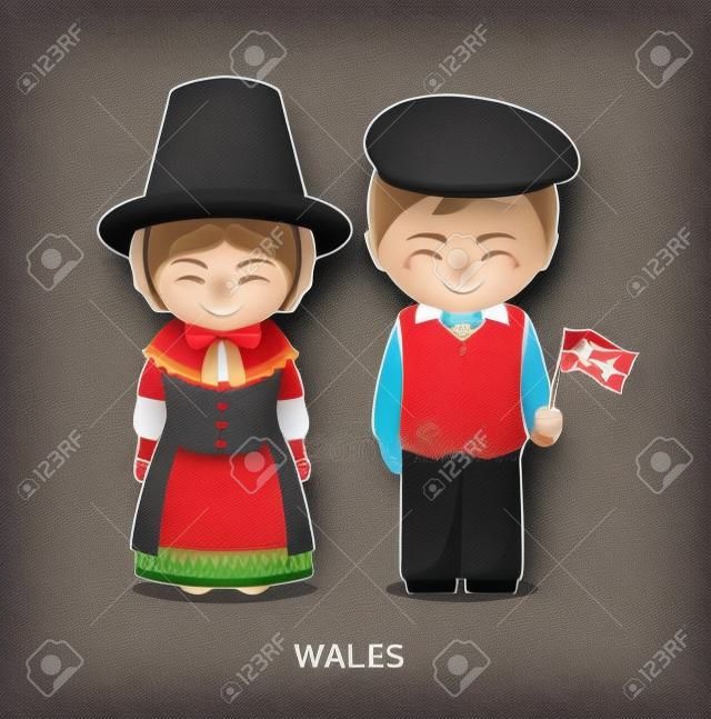 Gallese in abito nazionale con una bandiera. Uomo e donna in costume tradizionale. Viaggia in Galles. Illustrazione piana di vettore della gente