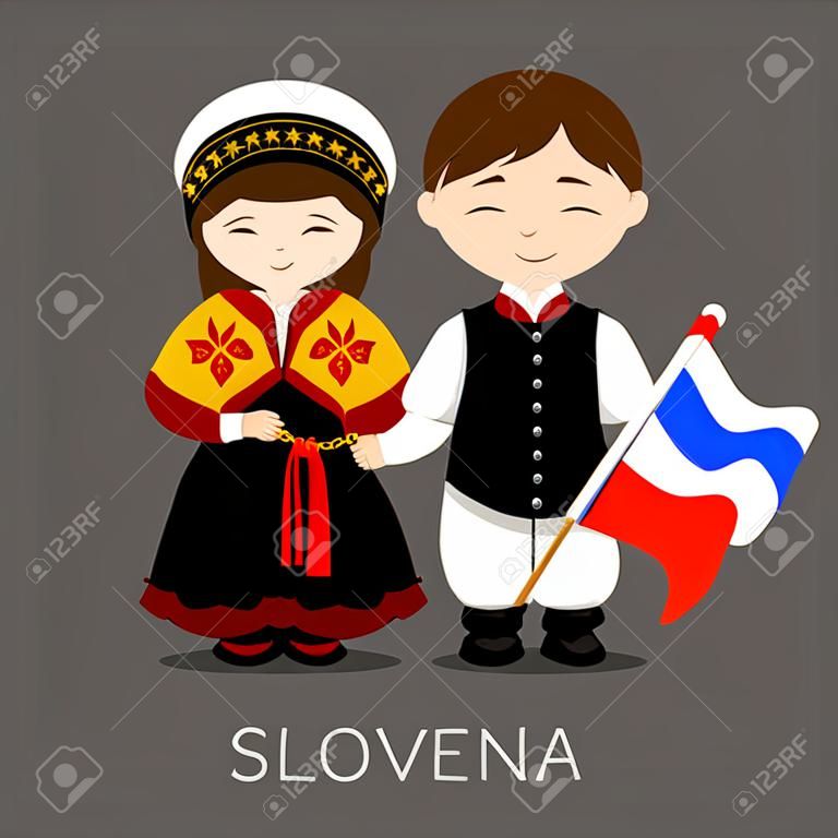 Slovenes in national dress with a flag.