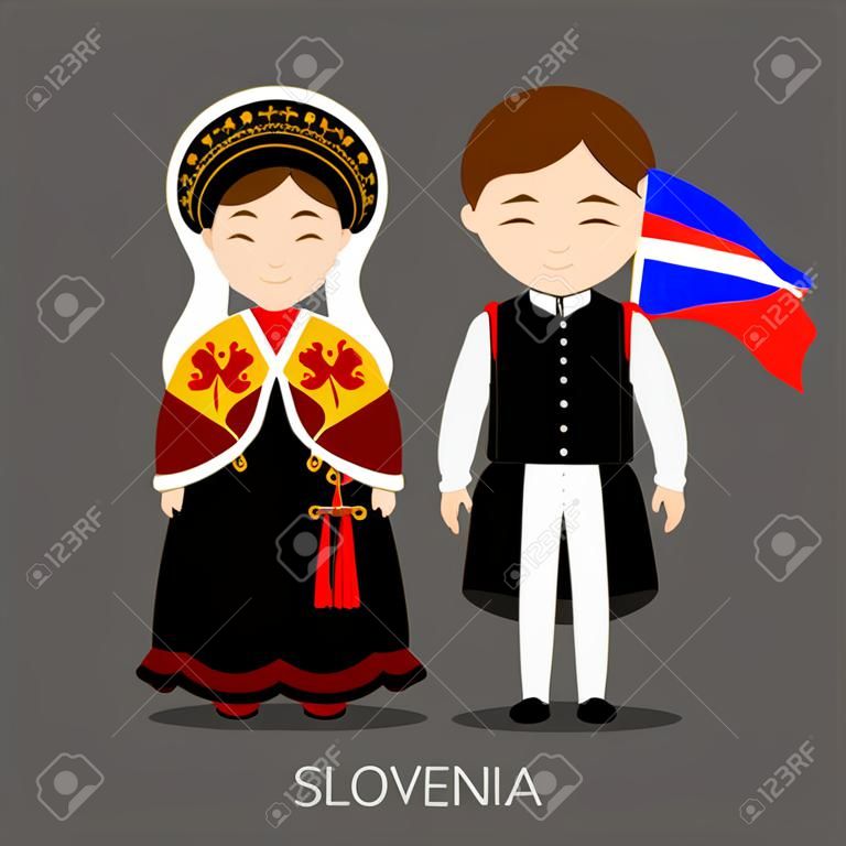 Slovenes in national dress with a flag.