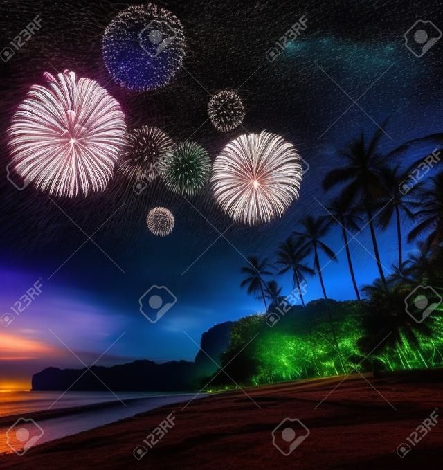 Beautiful fireworks above night tropical landscape with beautiful blue sky and stars. Thailand
