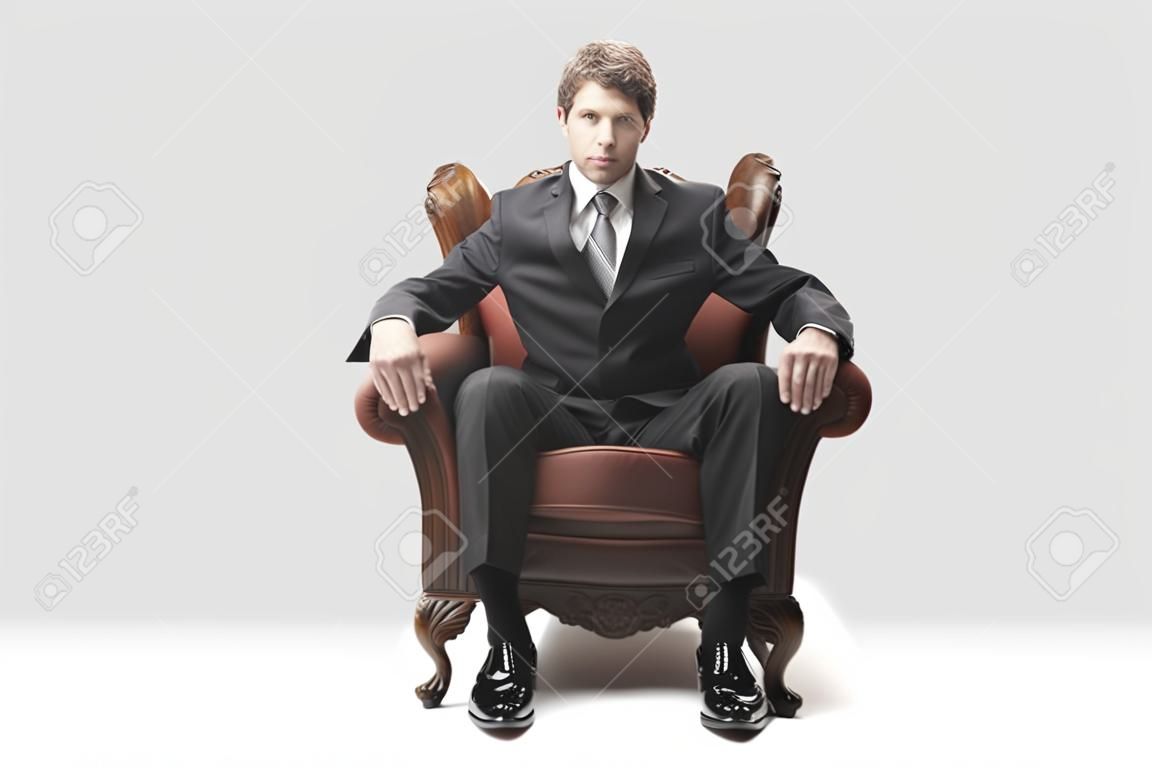 Businessman sitting on an armchair