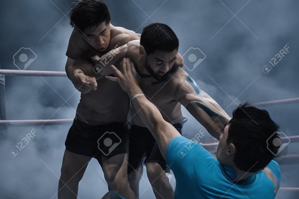 Three men in a fight