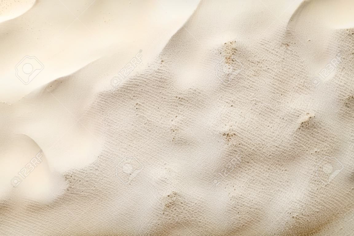 Sandy background. Summer beach texture. Top view. Copy space