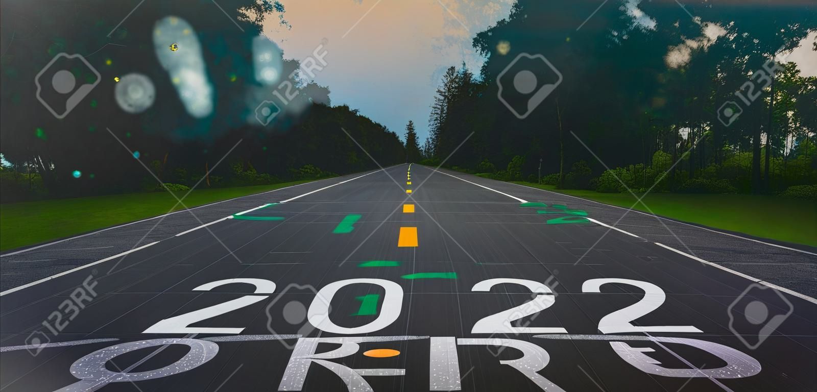 2022 new year or start straight concept.Virtual dashboardWord 2022 written on the asphalt road.Concept of challenge or career path and change with innovation business and technology.