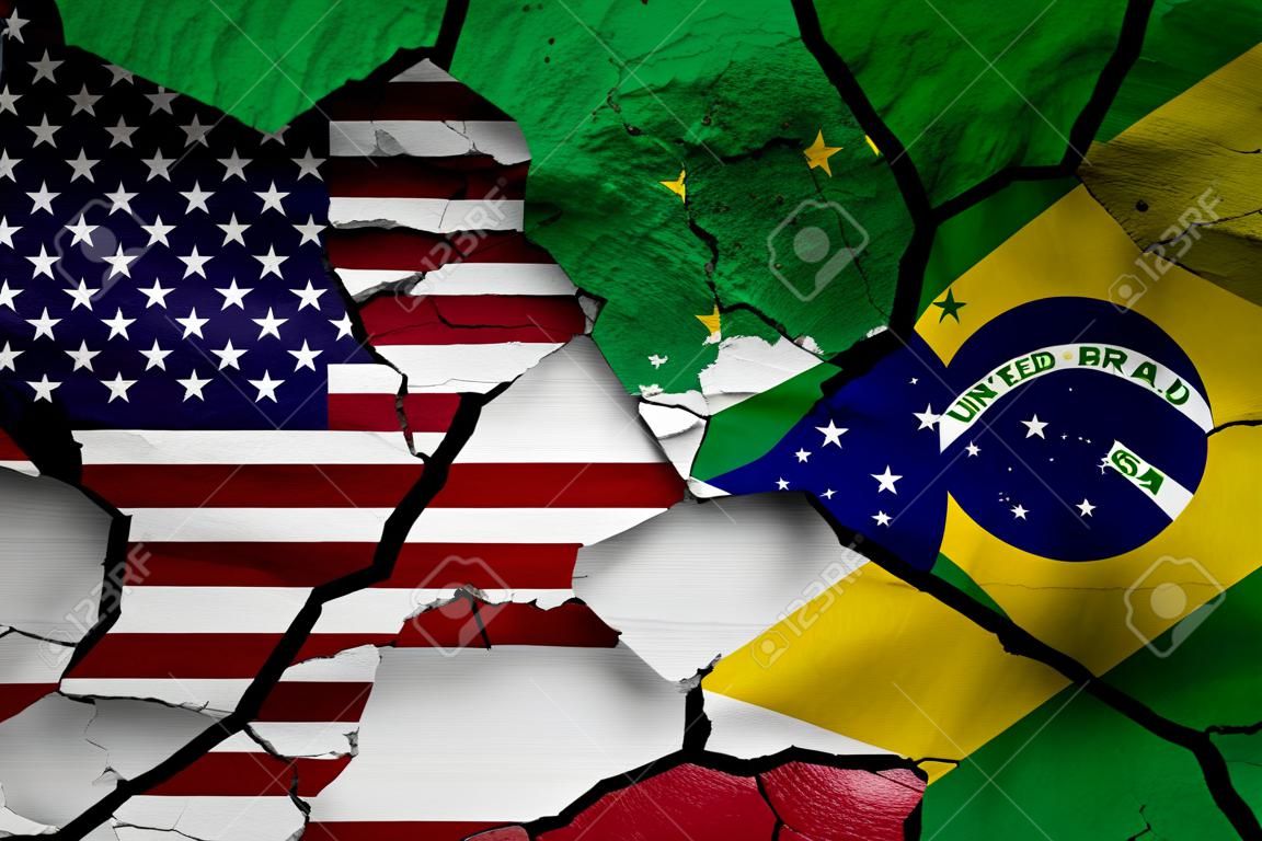 flags of United States and Brazil painted on cracked wall